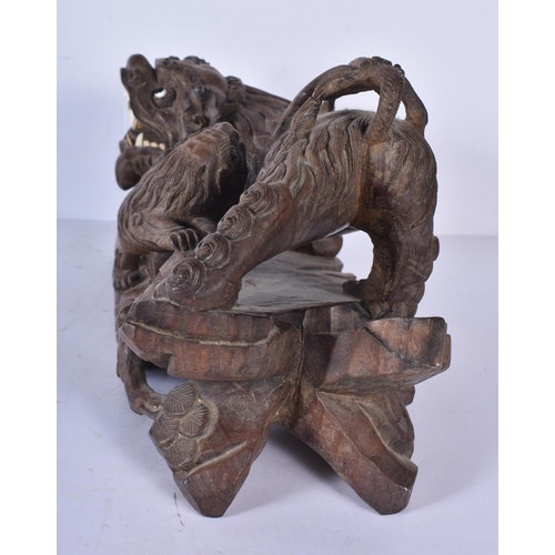 3041 - A large Japanese hardwood carving of a Mythical beast 18 x 32cm