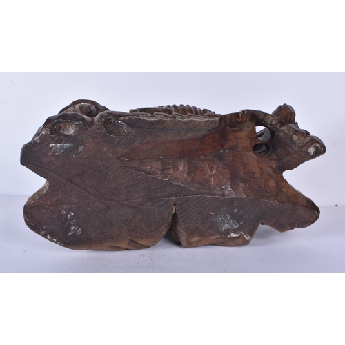 3041 - A large Japanese hardwood carving of a Mythical beast 18 x 32cm