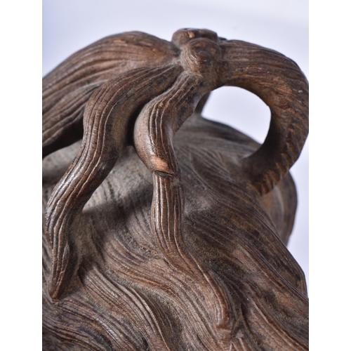 3041 - A large Japanese hardwood carving of a Mythical beast 18 x 32cm