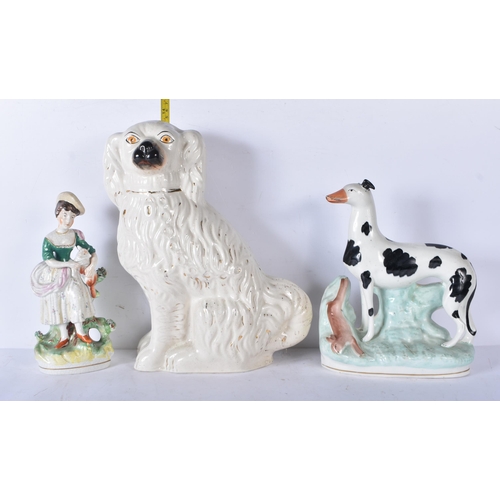 3056 - A large 19th Century Staffordshire  porcelain Dog together with another dog and a shepherdess 35cm ,