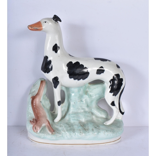 3056 - A large 19th Century Staffordshire  porcelain Dog together with another dog and a shepherdess 35cm ,