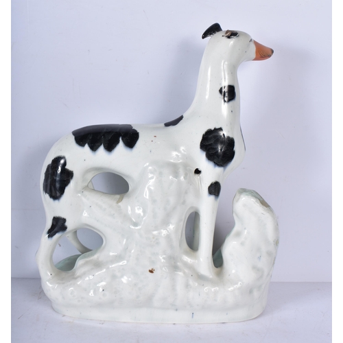 3056 - A large 19th Century Staffordshire  porcelain Dog together with another dog and a shepherdess 35cm ,