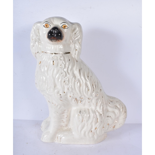 3056 - A large 19th Century Staffordshire  porcelain Dog together with another dog and a shepherdess 35cm ,