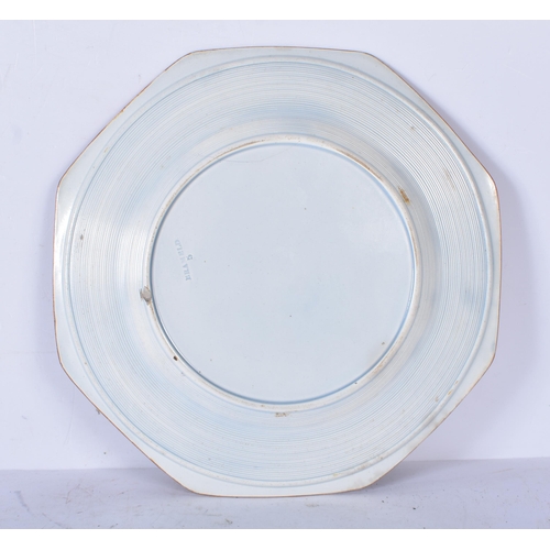 3060 - A 19th Century Rockingham pearlware octagonal plate decorated with a oriental pattern and impresses ... 
