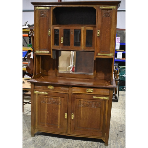 3142 - An Arts and Craft oak Dresser. 200cm x 140cm x 55cm