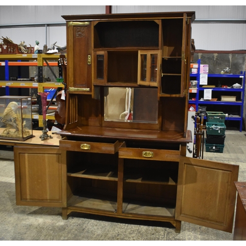 3142 - An Arts and Craft oak Dresser. 200cm x 140cm x 55cm
