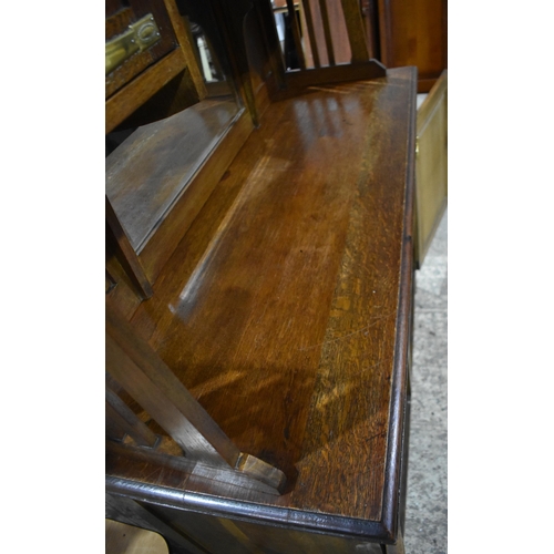 3142 - An Arts and Craft oak Dresser. 200cm x 140cm x 55cm