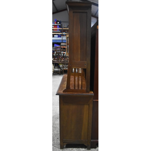 3142 - An Arts and Craft oak Dresser. 200cm x 140cm x 55cm