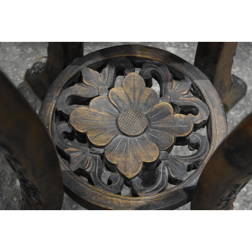 3180 - A Chinese carved hardwood stand with a marble insert 95 x 40cm