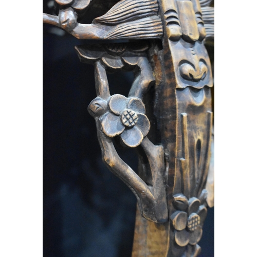 3180 - A Chinese carved hardwood stand with a marble insert 95 x 40cm