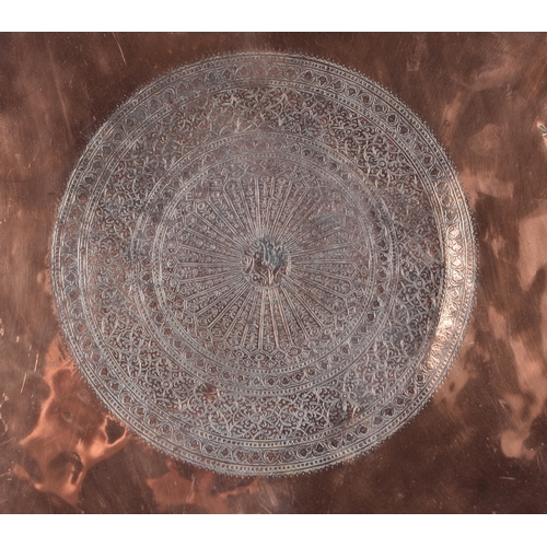3191 - A large Middle eastern copper tray etched with Tugra and script and hammered scalloped rim 72 cm dia... 