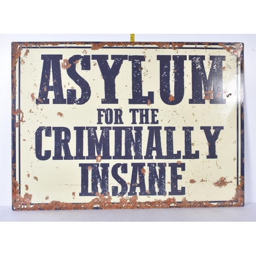 3247 - An  Asylum tin sign 70 x 50cm