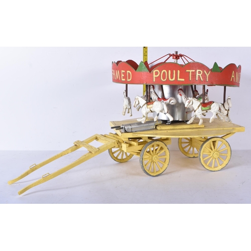 3261 - An early 20th Century folk art scratch built wooden and metal model carousel with painted lead and m... 