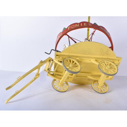 3261 - An early 20th Century folk art scratch built wooden and metal model carousel with painted lead and m... 