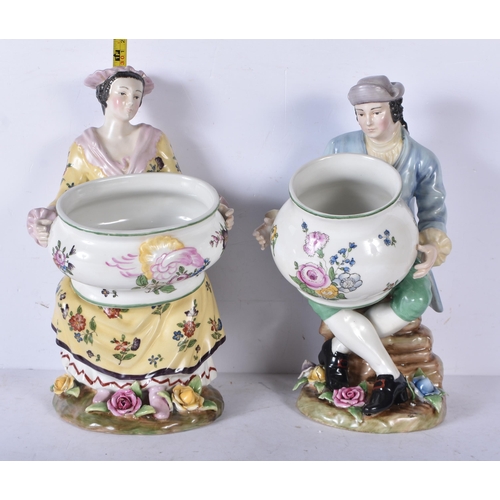 3262 - A pair of porcelain figural bonbon dishes 29cm (2)