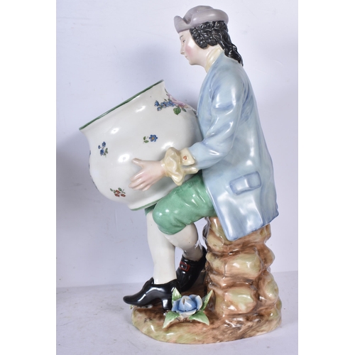 3262 - A pair of porcelain figural bonbon dishes 29cm (2)