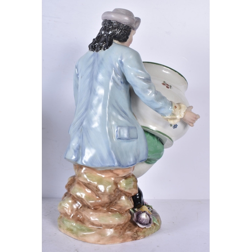 3262 - A pair of porcelain figural bonbon dishes 29cm (2)