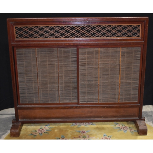 3302 - A Japanese wooden sliding screen with a carved wood fretwork frieze 110 x 133 cm