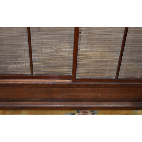3302 - A Japanese wooden sliding screen with a carved wood fretwork frieze 110 x 133 cm
