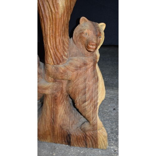 3303 - A large carved wood bear group 102cm