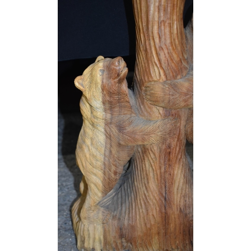 3303 - A large carved wood bear group 102cm