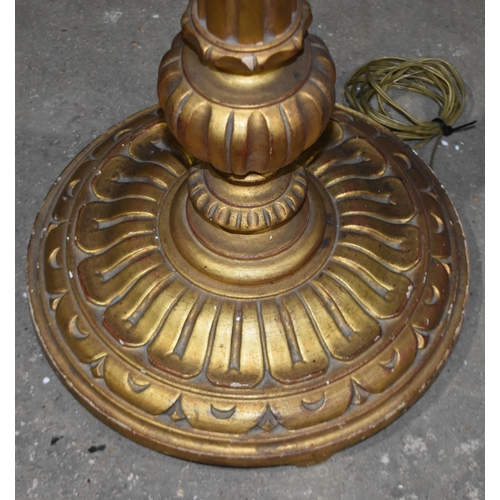 3346 - A gilt wood floor standing lamp with shade 145cm