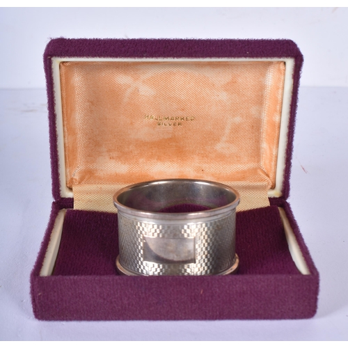 3408 - A silver napkin together with silver plated items, weight of silver napkin 14.6g(15)