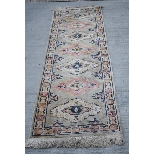 3414 - An Anatolian runner rug 230 x 68cm