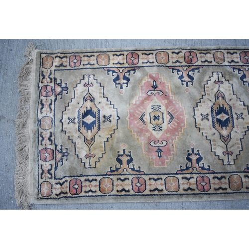 3414 - An Anatolian runner rug 230 x 68cm
