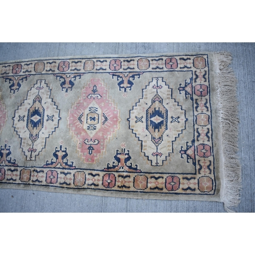 3414 - An Anatolian runner rug 230 x 68cm
