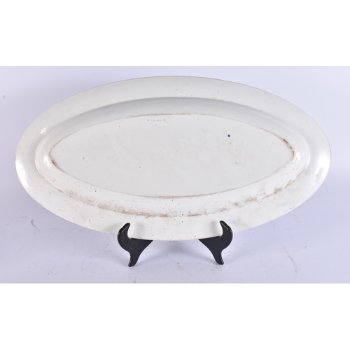 100 - AN UNUSUAL LARGE EARLY 19TH CENTURY WEDGWOOD BLUE AND WHITE DISH decorated with scenes of figures an... 