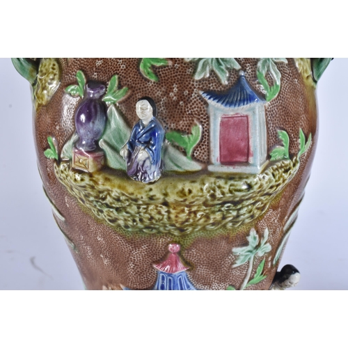 103 - A RARE LARGE PAIR OF 19TH CENTURY MAJOLICA VASES AND COVERS unusually formed with Chinese figures an... 