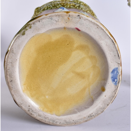 103 - A RARE LARGE PAIR OF 19TH CENTURY MAJOLICA VASES AND COVERS unusually formed with Chinese figures an... 