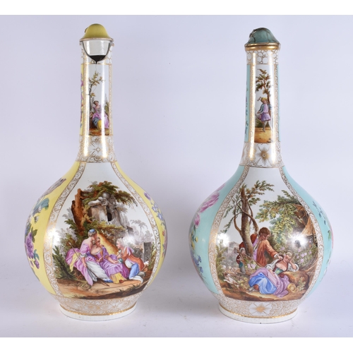 104 - A VERY LARGE PAIR OF 19TH CENTURY GERMAN PORCELAIN BOTTLE VASES AND COVERS painted with lovers in la... 