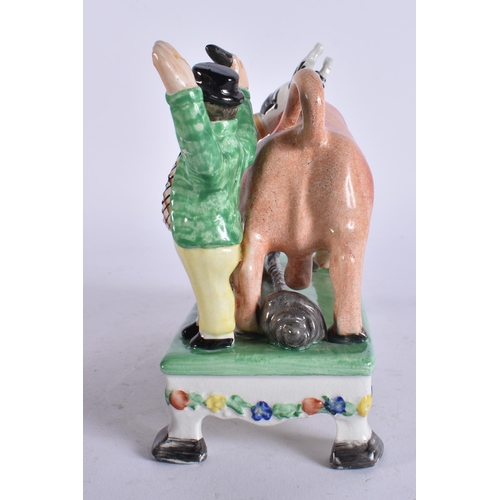 133 - AN ANTIQUE STAFFORDSHIRE BULL BEATING CAPTAIN FIGURAL GROUP. 17 cm x 14 cm.
