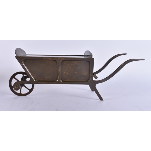 134 - AN ANTIQUE AMERICAN FOLK ART BRONZE WHEELBARROW MONEY BOX. 32 cm x 12 cm.