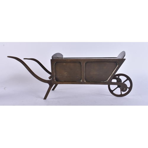 134 - AN ANTIQUE AMERICAN FOLK ART BRONZE WHEELBARROW MONEY BOX. 32 cm x 12 cm.