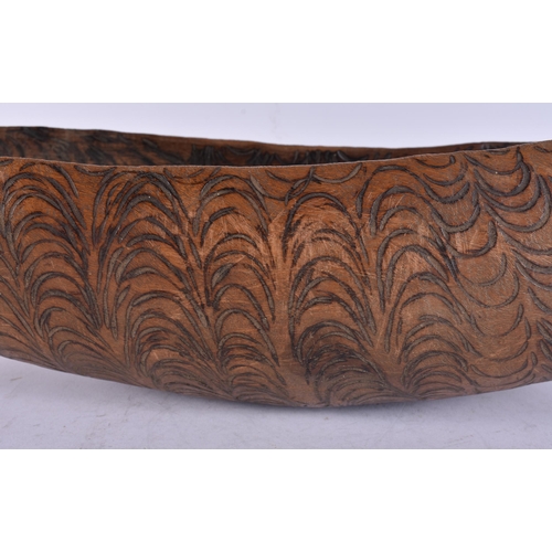 142 - A FINE AND UNUSUAL AUSTRALIAN ABORIGINAL CHIP CARVED BOWL decorated all over with foliage. 52 cm x 1... 