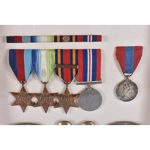 161 - A FRAMED MILITARY MEDAL GROUP including a Royal marines helmet plate & insignia, a Somerset light in... 