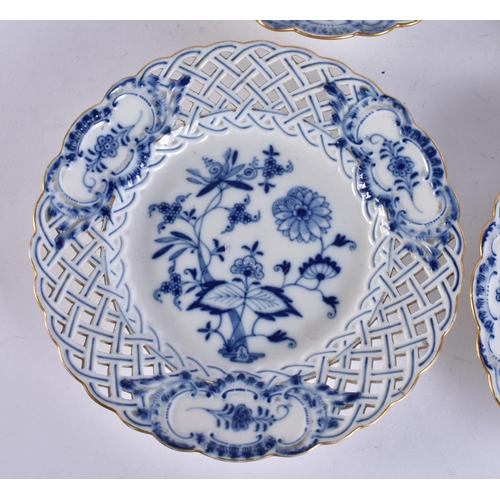 173 - A SET OF FOUR MEISSEN BLUE AND WHITE PORCELAIN RETICULATED PLATES. 21 cm wide. (4)