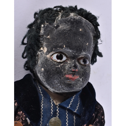 72 - AN UNUSUAL VINTAGE DOLL. 34 cm long.
