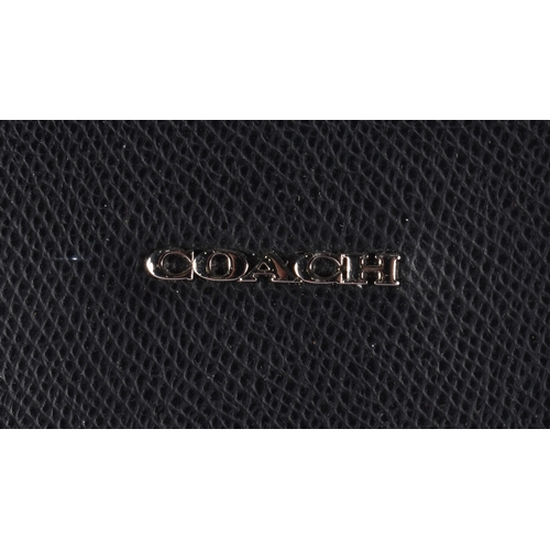 78 - A COACH LEATHER HANDBAG. 44 cm wide.