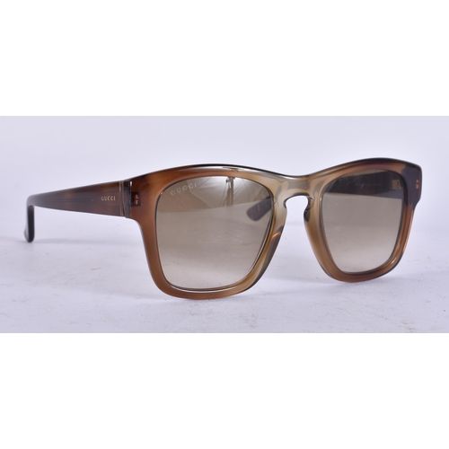 79 - A PAIR OF GUCCI SUNGLASSES. 14 cm wide.