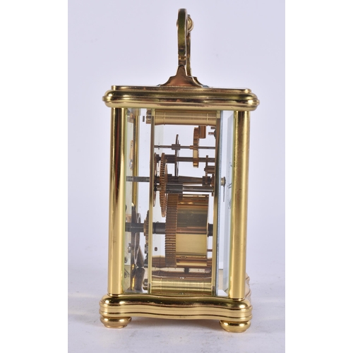 85 - A MATTHEW NORMAN CARRIAGE CLOCK. Working. 14 cm high inc handle.