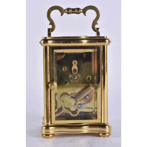 85 - A MATTHEW NORMAN CARRIAGE CLOCK. Working. 14 cm high inc handle.