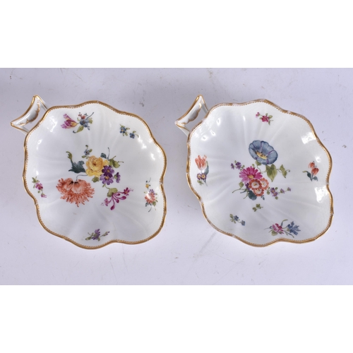 94 - A PAIR OF ANTIQUE DANISH COPENHAGEN PORCELAIN LEAF SHAPED DISHES painted with flowers. 18 cm x 13 cm... 