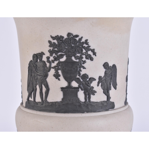 96 - AN EARLY 19TH CENTURY JASPERWARE PEDESTAL VASE decorated with classical figures. 21 cm x 15 cm.