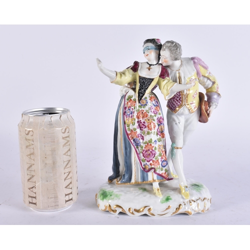 99 - AN ANTIQUE GERMAN PORCELAIN FIGURE OF A DANCING MALE AND FEMALE. 20 cm high.