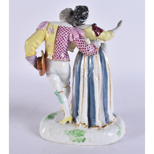 99 - AN ANTIQUE GERMAN PORCELAIN FIGURE OF A DANCING MALE AND FEMALE. 20 cm high.