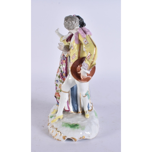 99 - AN ANTIQUE GERMAN PORCELAIN FIGURE OF A DANCING MALE AND FEMALE. 20 cm high.